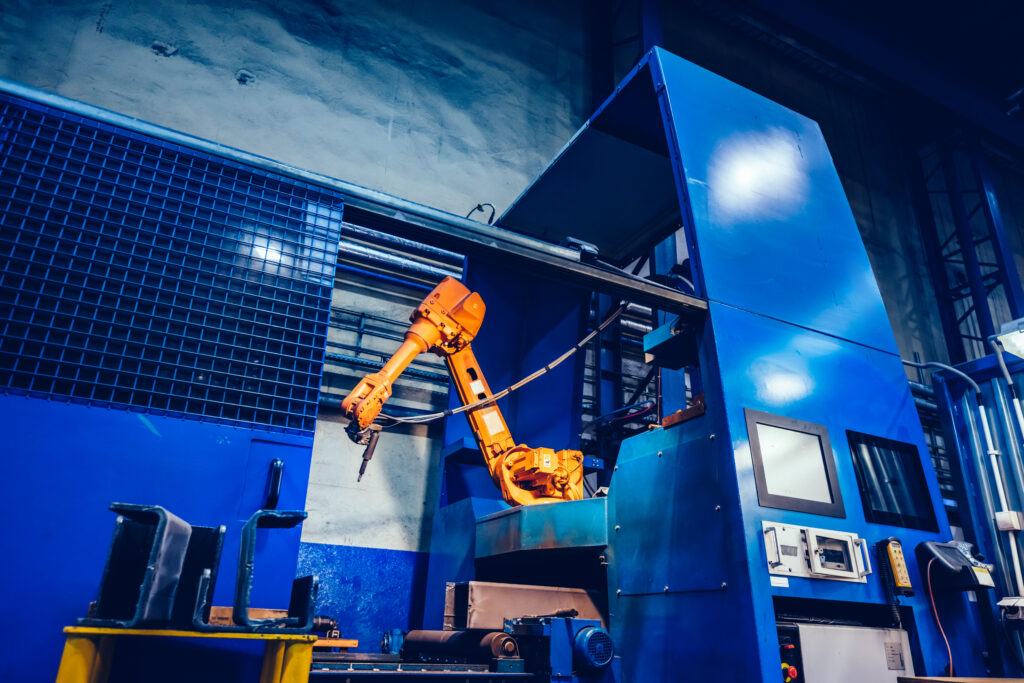heavy-duty industrial metal injection mold or an automated assembly line robotic arm working on high-end hardware casings